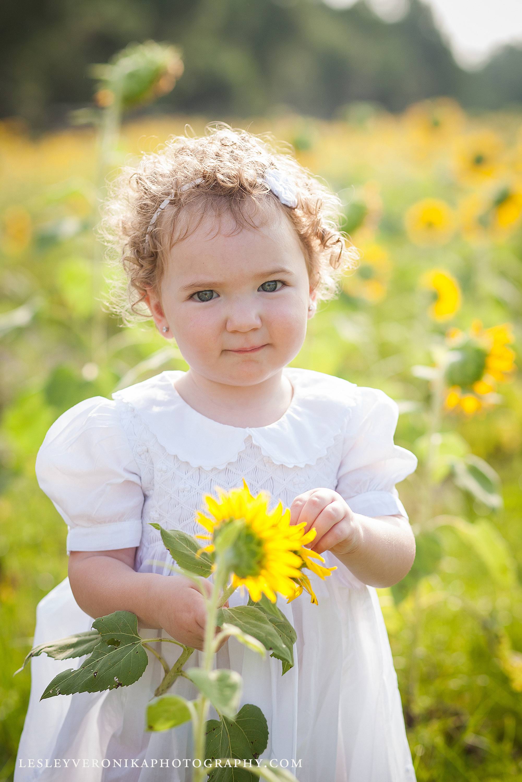 Wilmington nc children photographer, wilmington nc family photographer, north carolina family photographer, nc beach family photographer, sunflowers, sunflower session, sunflower photos, baby photography, wilmington nc baby photographer, Baby's first year,