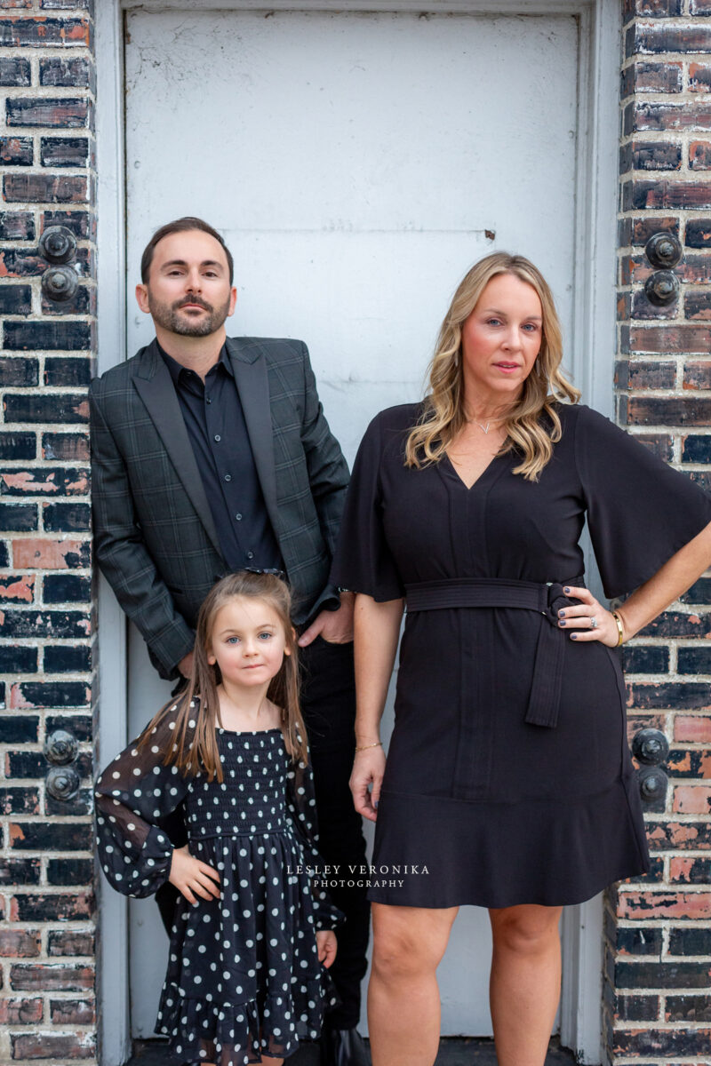 family portraits, wilmington nc family photographer, family of three, downtown wilmington, urban family portraits, children portraits, child, what to wear family session, what to wear black clothes, parents, loving family, sweet girl, family photography