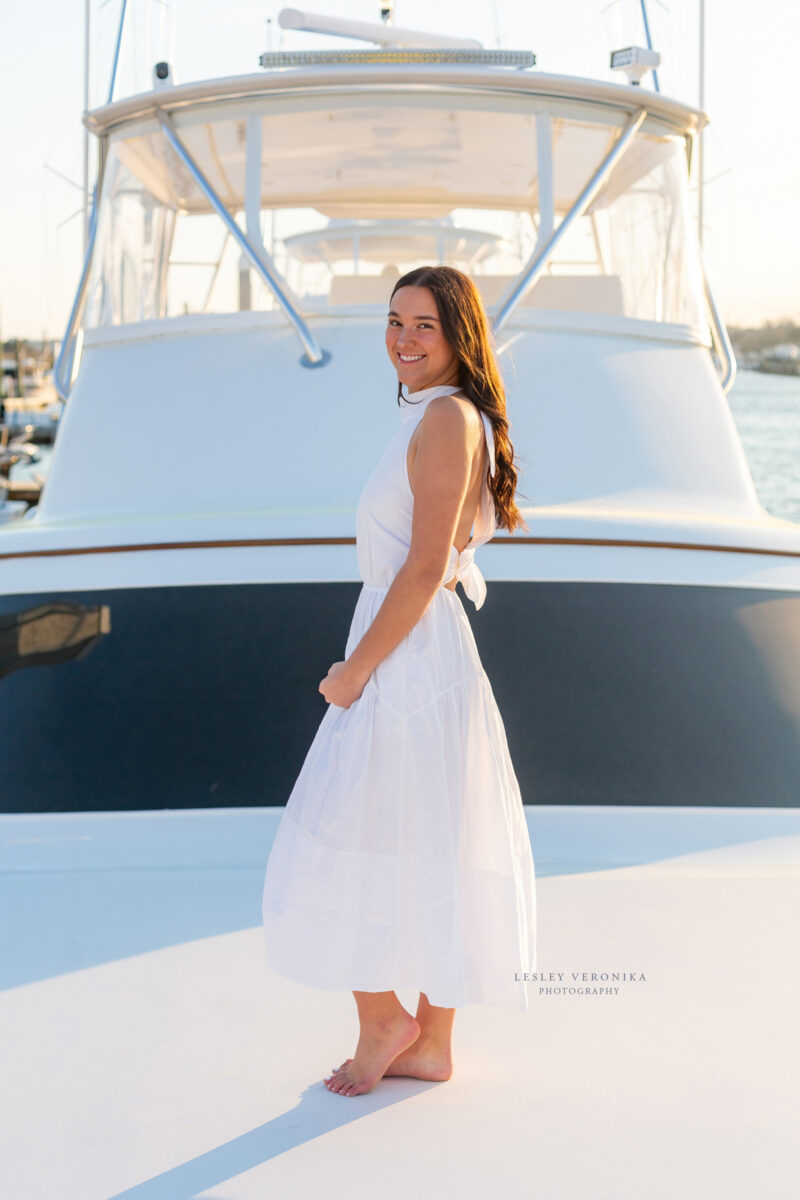 senior photographer, Senior portrait session, wrightsville beach nc, boat, yacht, yacht club, senior portraits on a boat, beach senior portraits