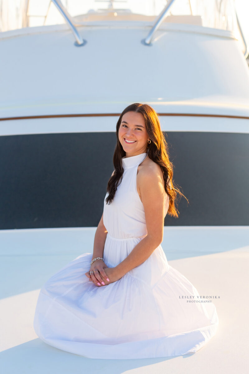 senior photographer, Senior portrait session, wrightsville beach nc, boat, yacht, yacht club, senior portraits on a boat, beach senior portraits