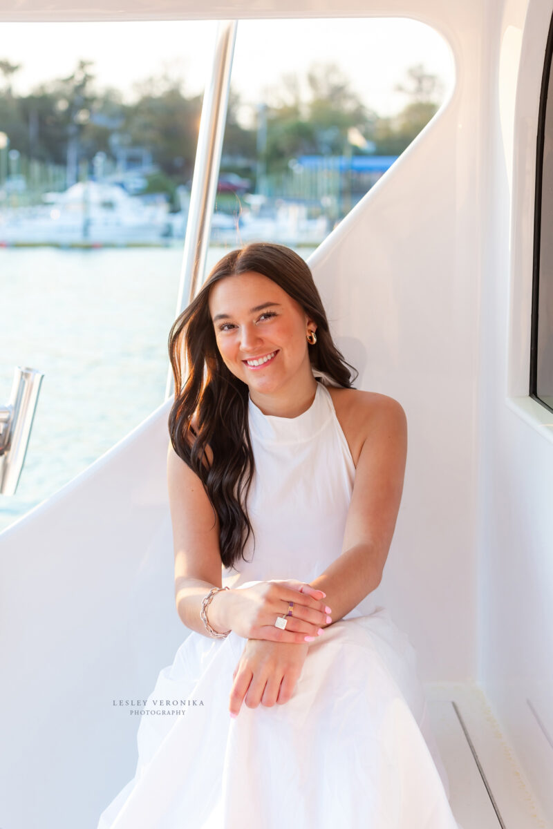 senior photographer, Senior portrait session, wrightsville beach nc, boat, yacht, yacht club, senior portraits on a boat, beach senior portraits